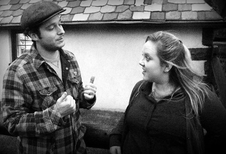 (Terry Malloy (Chris Botte) tells Edie (Noelle Fair) about his days as a prize fighter in a scene from Hudson Shakespeare’s stage adaptation of “On the Waterfront”)